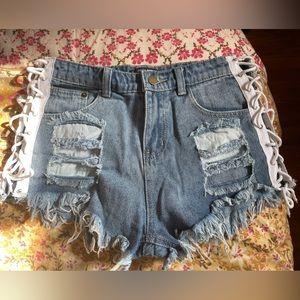 Fashion Nova, Size small distressed jean shorts, completely bare tie sides